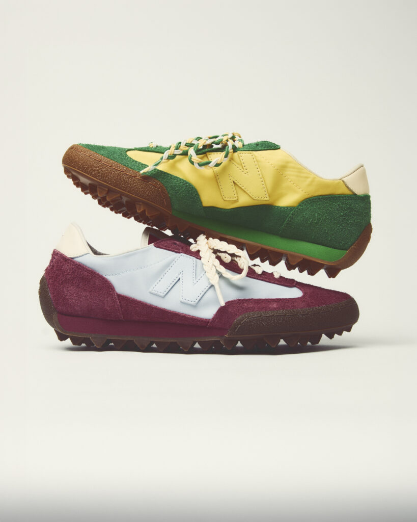 Stacked sneakers with a yellow and green suede upper, braided white-and-green laces, and a brown rugged sole as the top shoe.